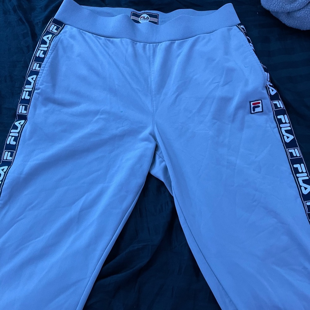 Fila track pants with logo on the sides.